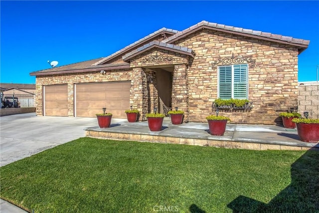 view of front of property featuring a garage and a front yard