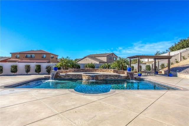 view of pool featuring an in ground hot tub, pool water feature, a pergola, and a patio