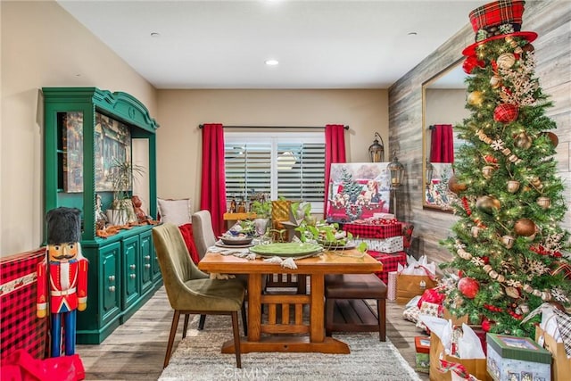 dining area with hardwood / wood-style floors