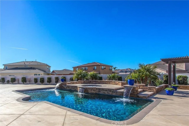 view of swimming pool featuring pool water feature, an in ground hot tub, a pergola, and a patio area