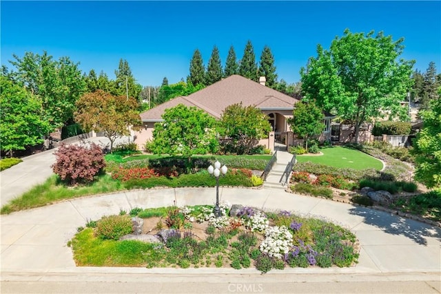 view of property hidden behind natural elements