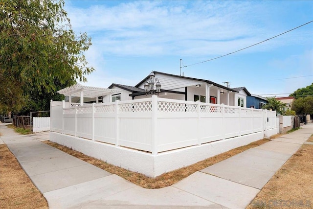 view of front facade with a pergola