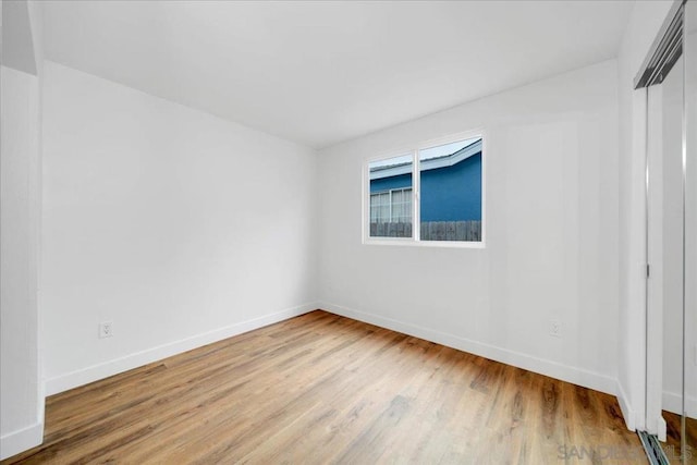 unfurnished room featuring light wood-type flooring