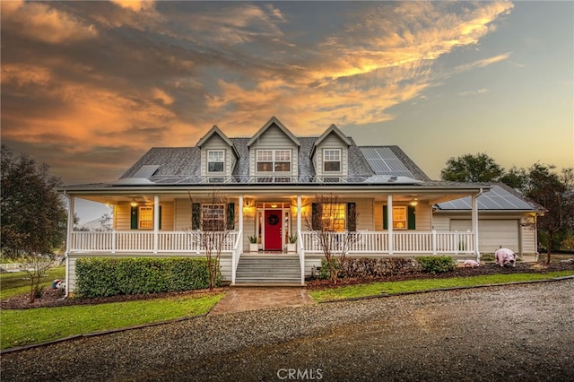 farmhouse-style home featuring solar panels and a porch