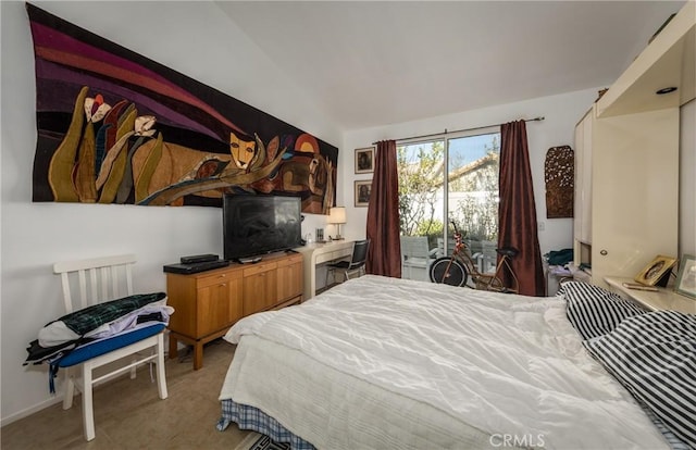 bedroom featuring lofted ceiling