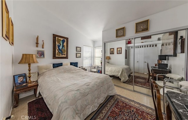 bedroom featuring a closet and vaulted ceiling