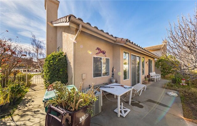 back of house featuring a patio area