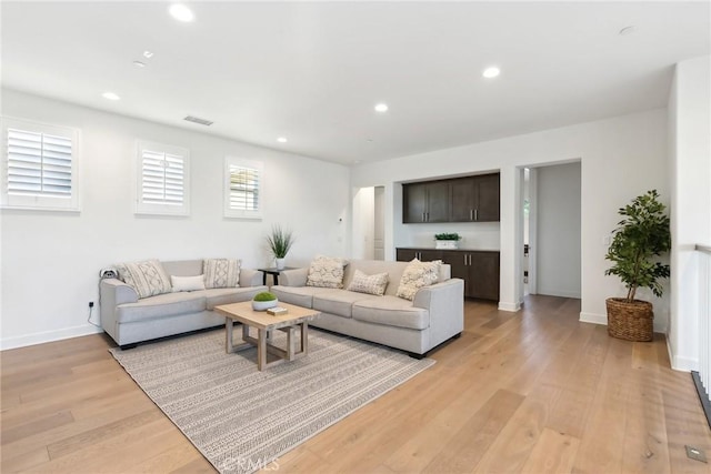 living room with light hardwood / wood-style floors