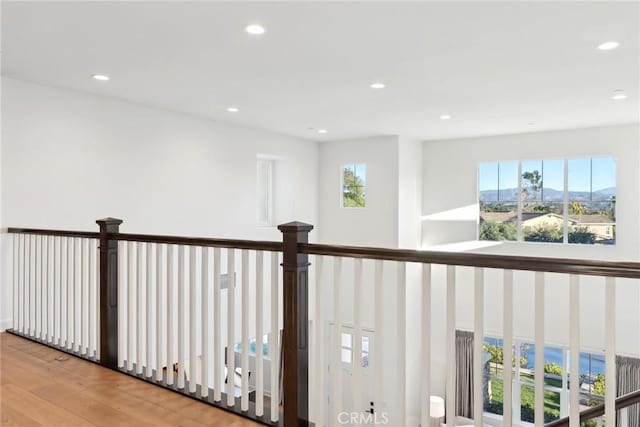 hallway featuring plenty of natural light and light wood-type flooring