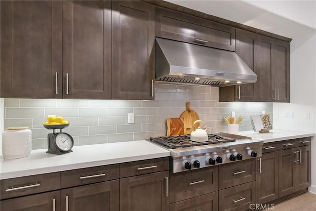 kitchen with tasteful backsplash, dark brown cabinetry, and stainless steel gas cooktop