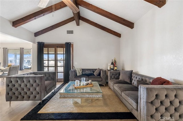 living room featuring light hardwood / wood-style floors, ceiling fan, french doors, high vaulted ceiling, and beamed ceiling