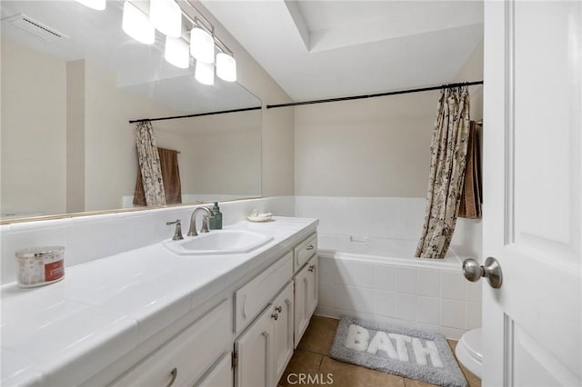 full bathroom with toilet, vanity, tile patterned flooring, and shower / bath combo with shower curtain