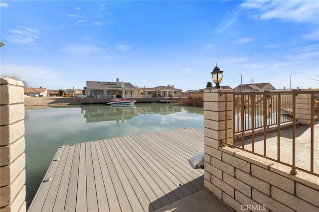 dock area with a water view