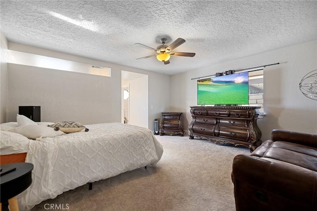 carpeted bedroom with a textured ceiling, ceiling fan, and connected bathroom