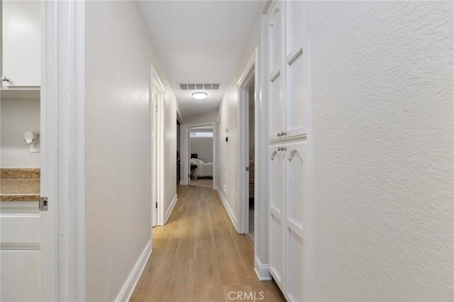 hallway featuring light hardwood / wood-style floors