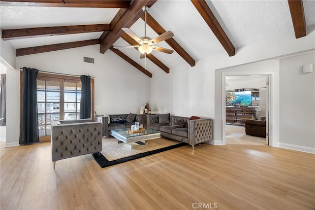 living room with a textured ceiling, light hardwood / wood-style floors, ceiling fan, high vaulted ceiling, and beam ceiling