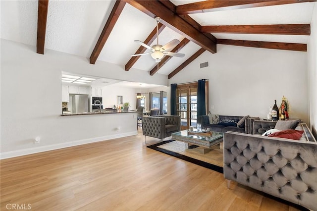 living room featuring ceiling fan, french doors, high vaulted ceiling, light hardwood / wood-style flooring, and beamed ceiling