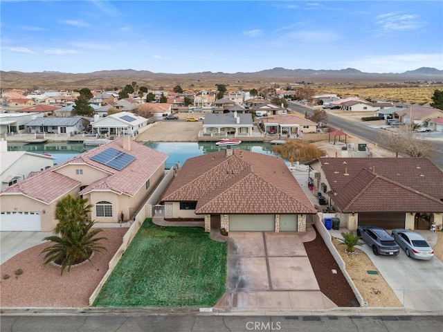 birds eye view of property featuring a mountain view