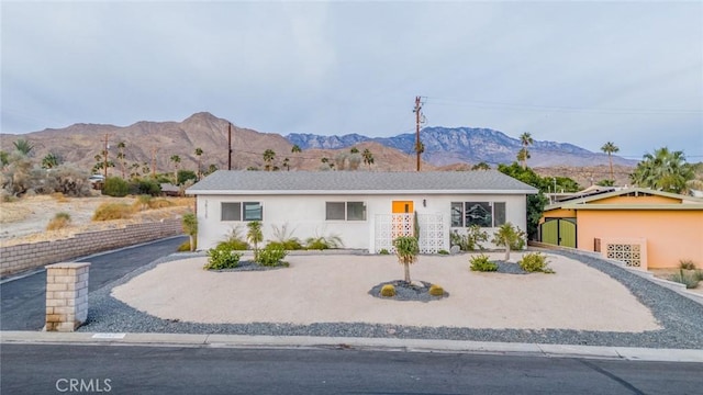 ranch-style home with a mountain view