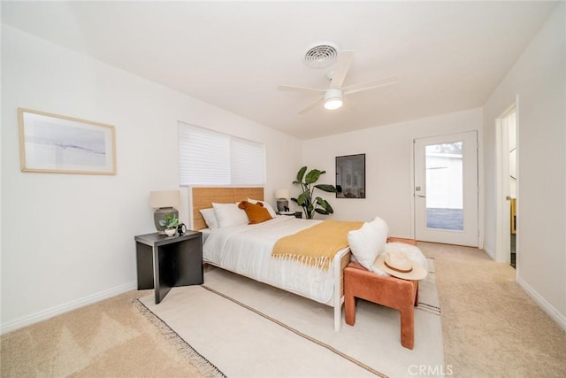 carpeted bedroom with ceiling fan and access to exterior