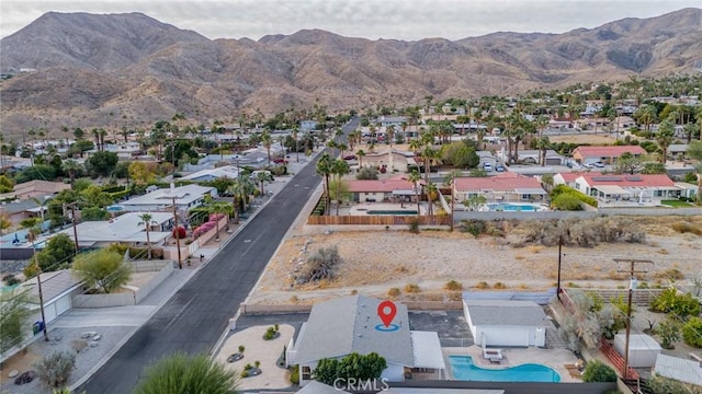 drone / aerial view featuring a mountain view