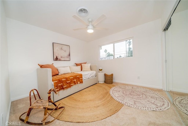 bedroom with ceiling fan and a closet