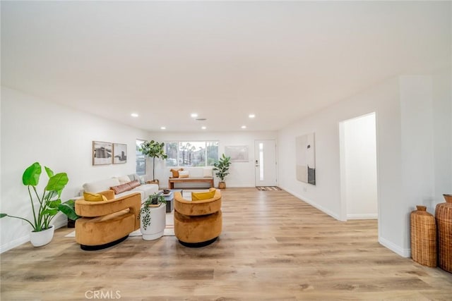 living room with light hardwood / wood-style floors