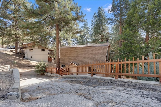 rear view of property with a wooden deck