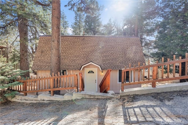 view of front of property with roof with shingles