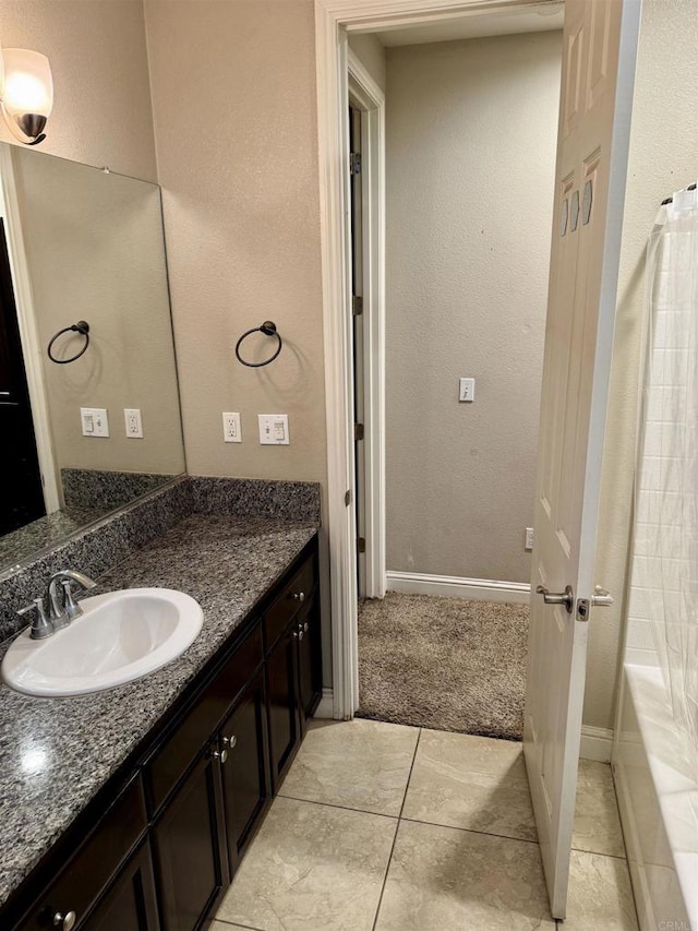 bathroom featuring vanity, tile patterned flooring, and shower / tub combo