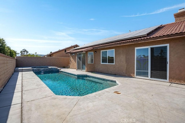 view of swimming pool with a patio and an in ground hot tub