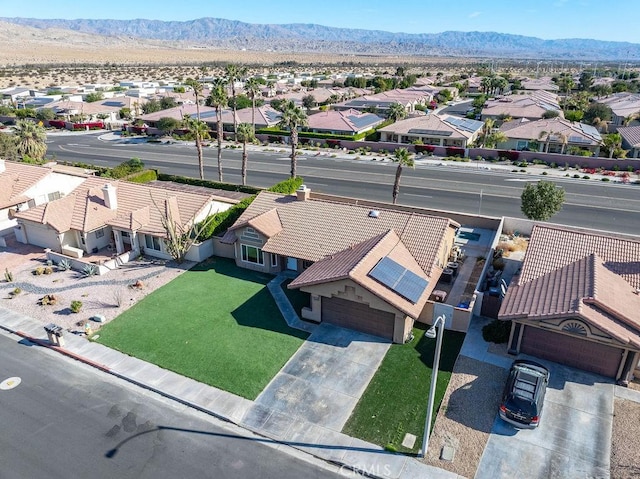 birds eye view of property featuring a mountain view