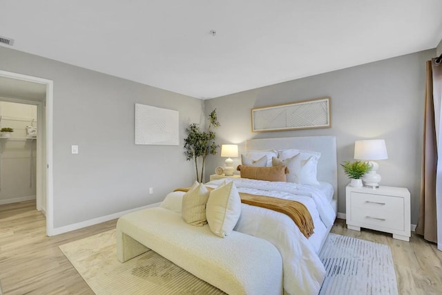 bedroom with light wood-type flooring