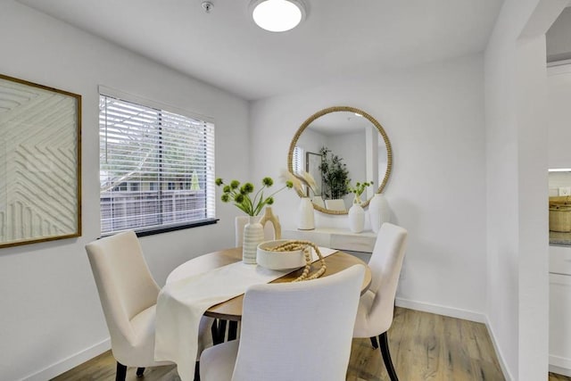 dining room with light wood-type flooring