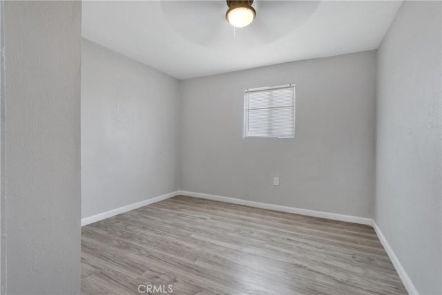 spare room with light hardwood / wood-style floors