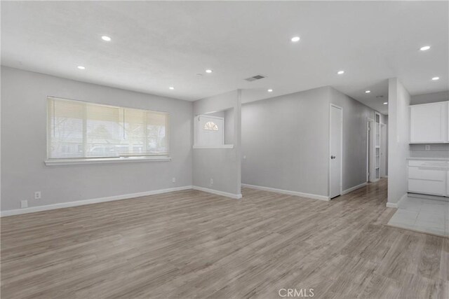 unfurnished living room with light hardwood / wood-style floors