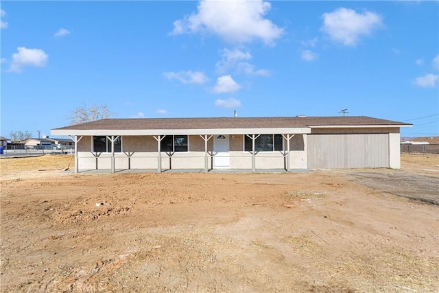 view of front of house featuring an outbuilding