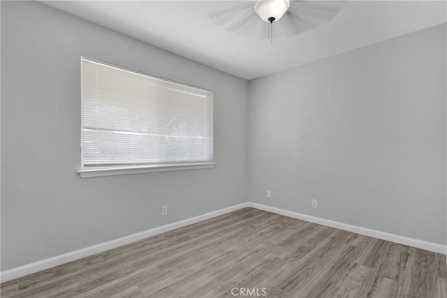 empty room with light hardwood / wood-style floors