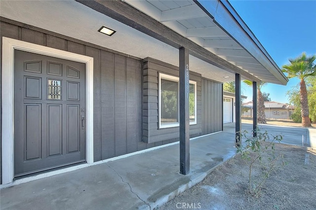 doorway to property with covered porch