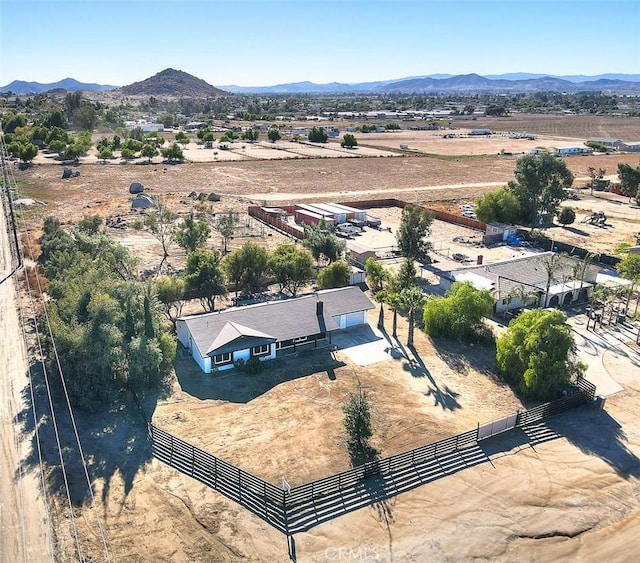 birds eye view of property featuring a mountain view