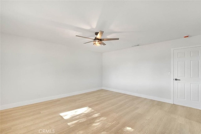 spare room with ceiling fan and light hardwood / wood-style floors