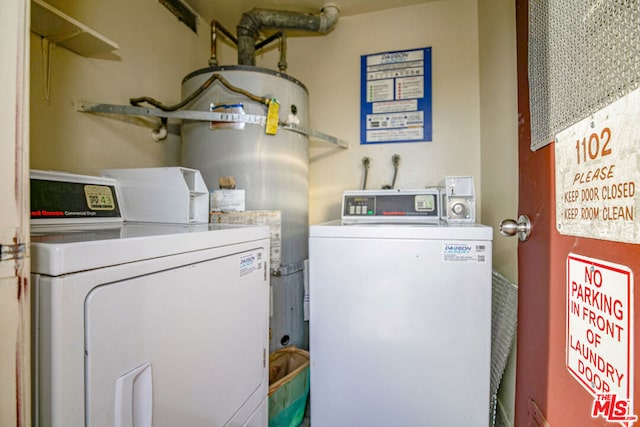 laundry area featuring washer and dryer and water heater