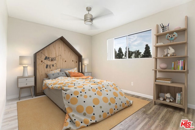 bedroom featuring hardwood / wood-style floors and ceiling fan