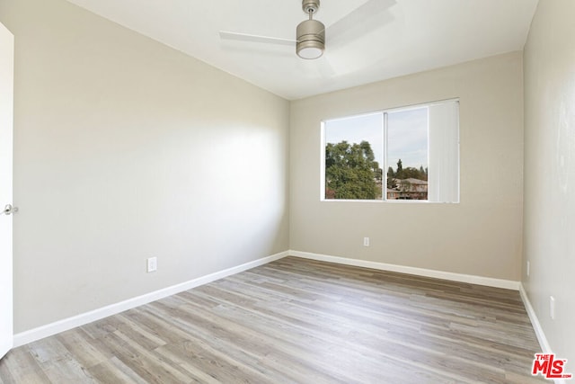 unfurnished room featuring ceiling fan and light hardwood / wood-style flooring