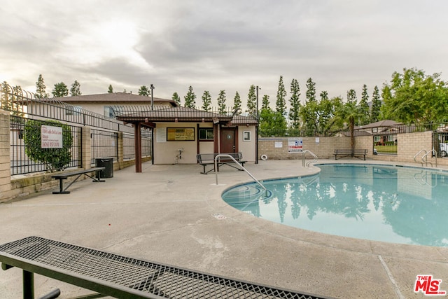 view of pool featuring a patio