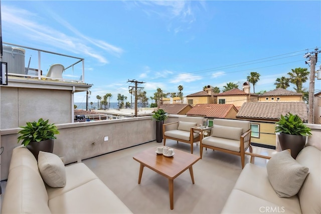 view of patio featuring an outdoor hangout area and a balcony