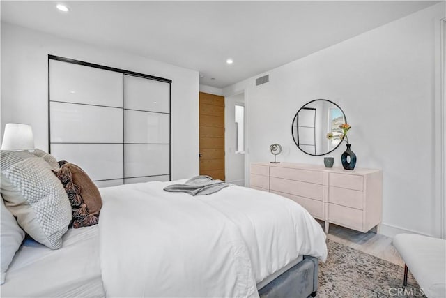 bedroom featuring hardwood / wood-style floors