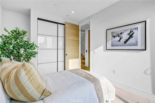 bedroom featuring wood-type flooring