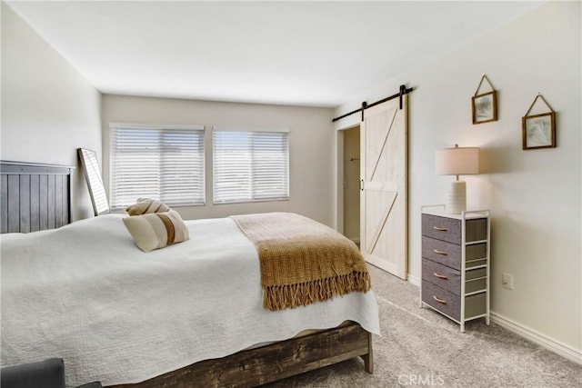 22616 Cardinal St, Grand Terrace, CA 92313 - bedroom featuring a barn door, carpet floors, and baseboards