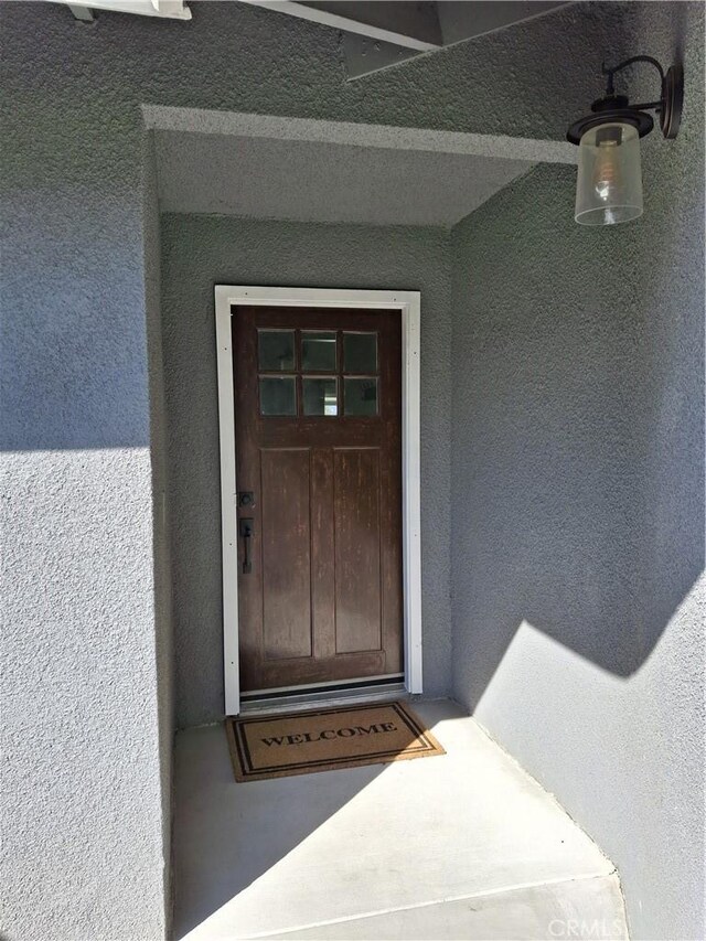 22616 Cardinal St, Grand Terrace, CA 92313 - doorway to property with stucco siding